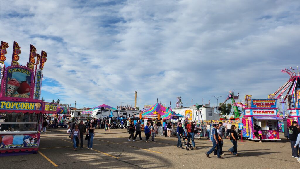 Festival-goers walking around the midway at Whoop-Up Days 2024. (File photo: J. Goulet, My Lethbridge Now)