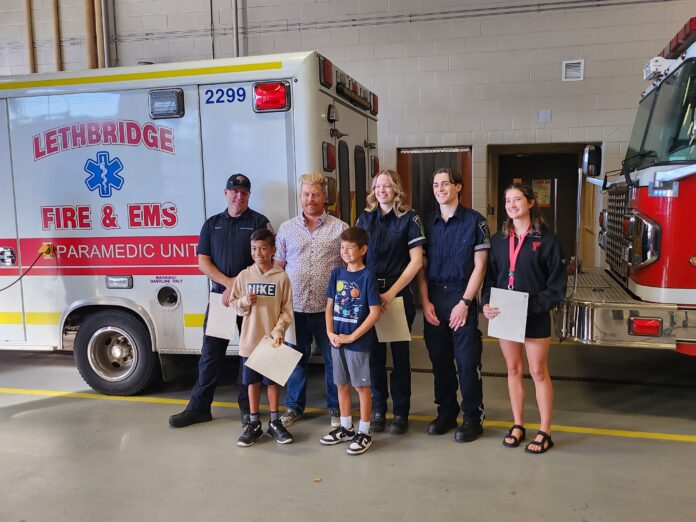 Local heroes were celebrated on September 27, 2024. Back from (L to R): Firefighter parademic Nicholas Spencer, Dr. Ryan Derman, and lifeguards Michaela Mcfarlane, Reese Walper and Drew Armener. Front row (L to R): Benjamin Nunez and Carter Lam. (Photo: J. Goulet, My Lethbridge Now)
