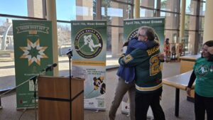 Lethbridge mayor Blaine Hyggen hugs Toby Boulet after giving him his King Charles III Coronation Medal, March 12, 2025. (Photo: J. Goulet, My Lethbridge Now)