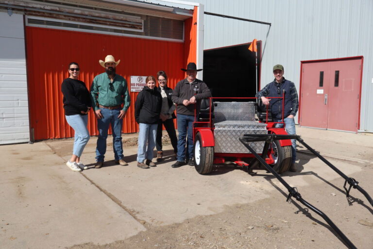 Carlene and Jarred Clark with the Allied Marketing Group, Alberta Carriage Supply Clinic instructors, Kale Hayes with the new Adaptive Cart (Photo mylethbridgenow.com staff)