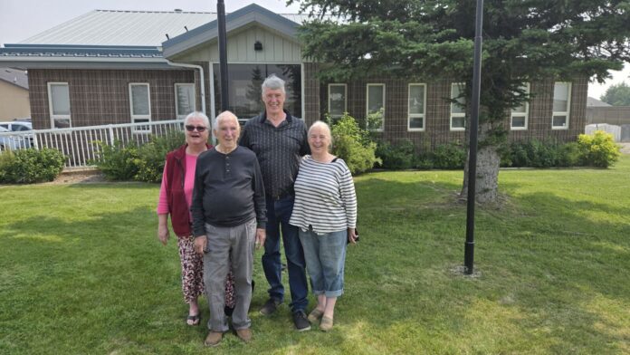 The Robinson family (L to R): Marion, Alan Sr., Alan Jr., and Marilyn outside the Coalhurst Town Office, June 11, 2025. (Photo: J. Goulet, My Lethbridge Now)