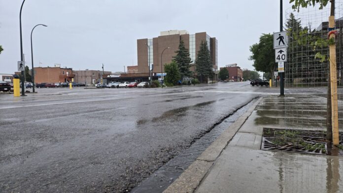 Rain falling in downtown Lethbridge, June 20, 2025. (Photo: J. Goulet, My Lethbridge Now)