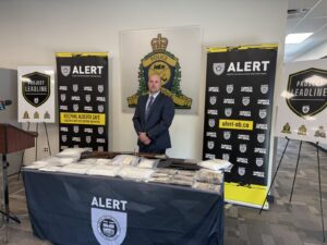 RCMP Inspector Brad Lundeen with seized items (Photo mylethbridgenow.com staff)